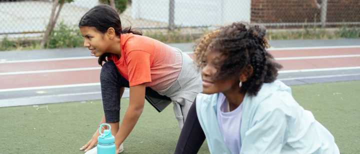 Girls stretching at track practice