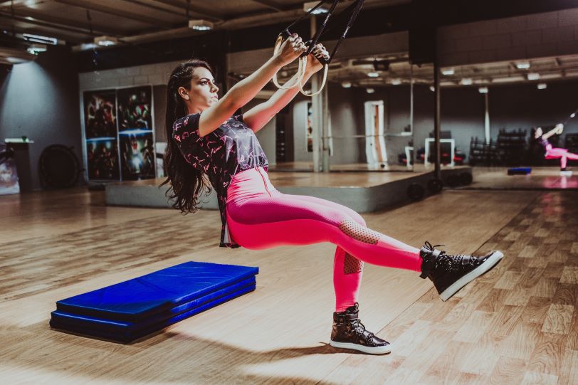 female working out on TRX