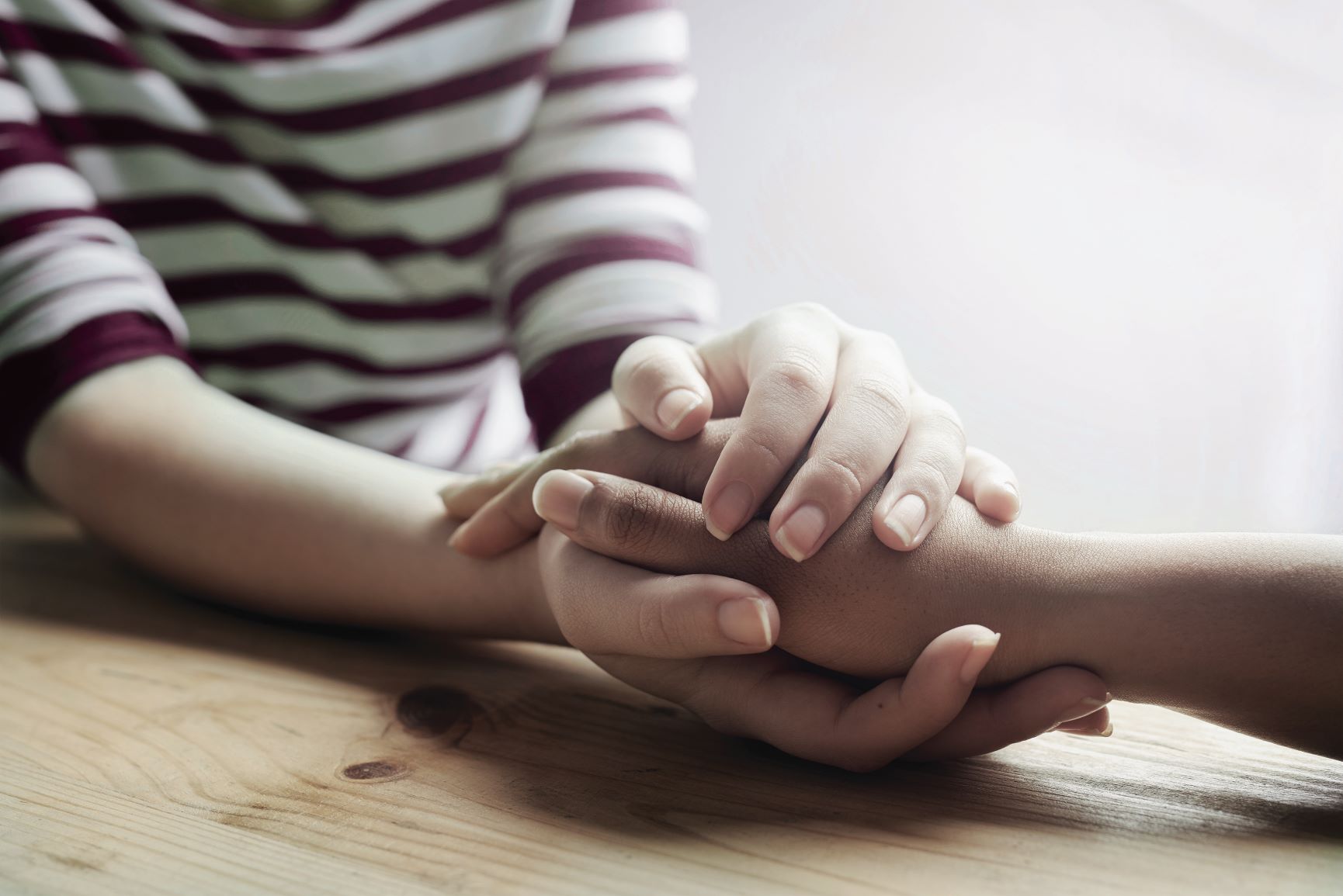 person grasping another person's hand