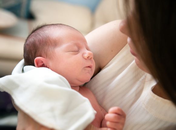 mom holding infant