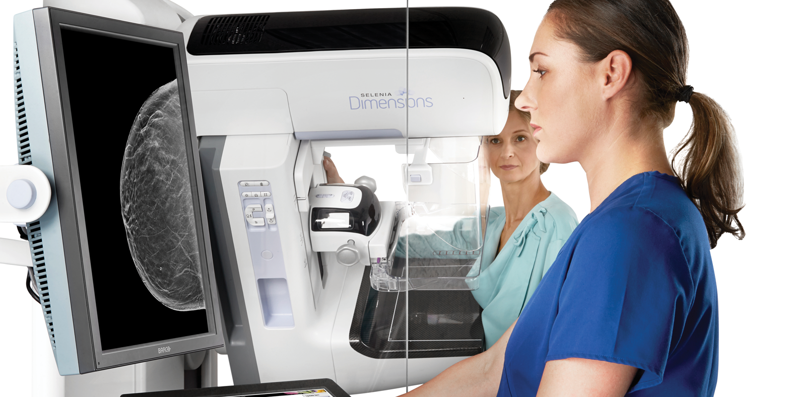 Technician and patient with New Genius™ 3D Mammography™ Tomosynthesis Technology