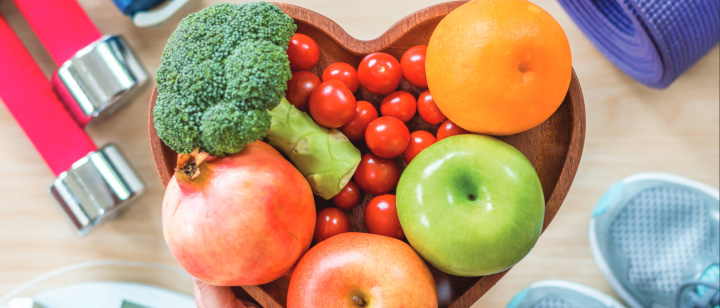 Heart shaped bowl of fruits and vegetables