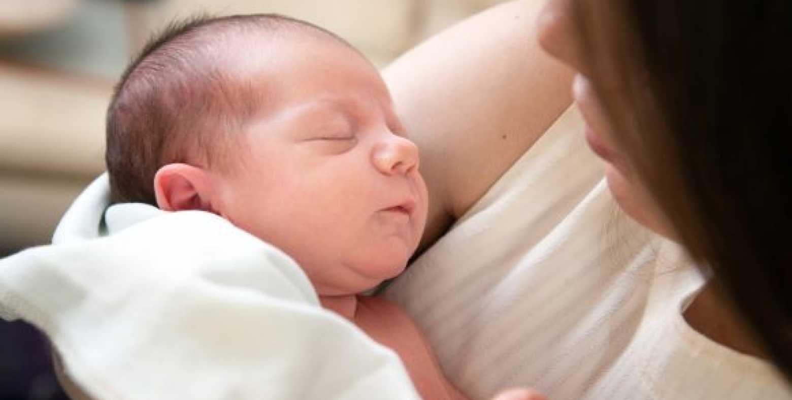 mom holding baby