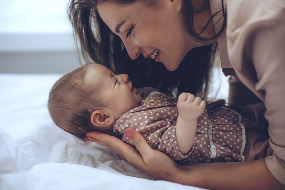 Mom snuggling baby